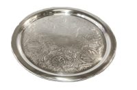 The 15" Round silver tray is embossed.